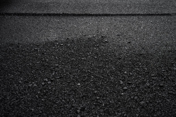 istock Layer of new asphalt raw material 643535244