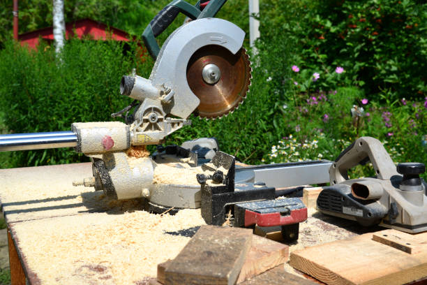 istock Circular saw and other tools on background of nature in summer 643538076