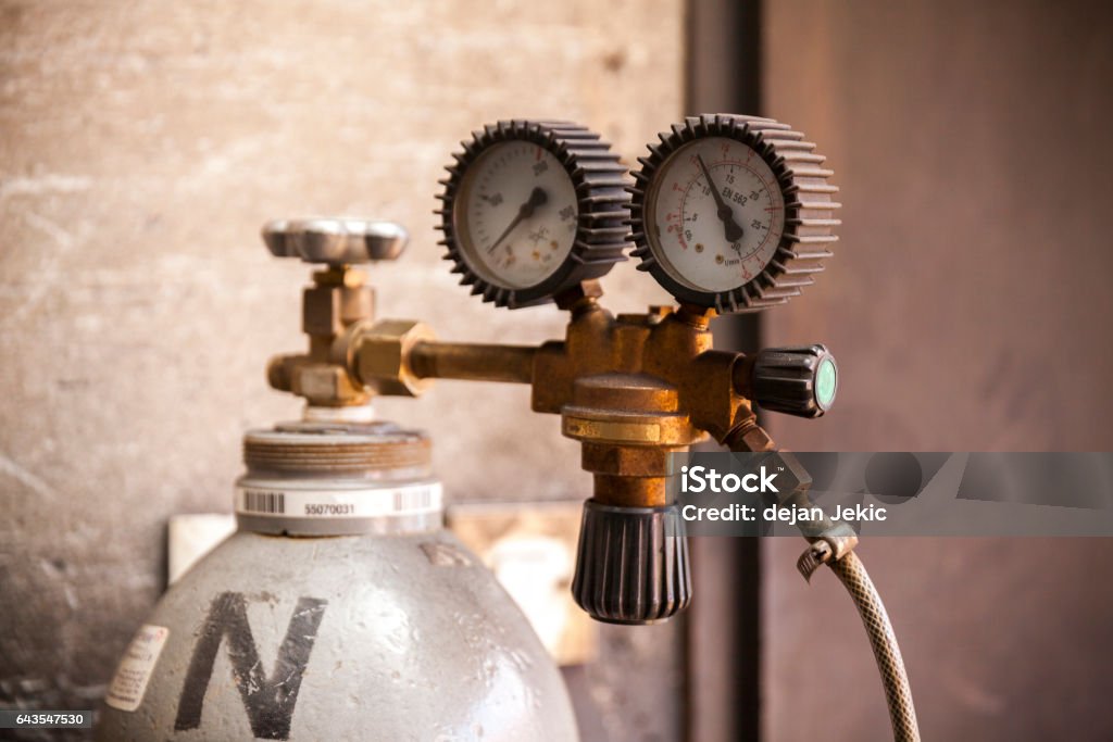 acetylene bottle acetylene bottle with pressure regulator, close up Gas Tank Stock Photo