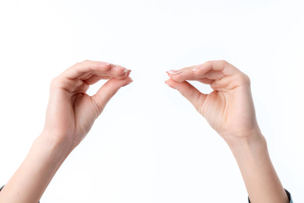 istock women's hands one opposite another with clenched fingers isolated on white background 643548470