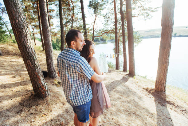 istock Loving couple on the beach near the water 643552838