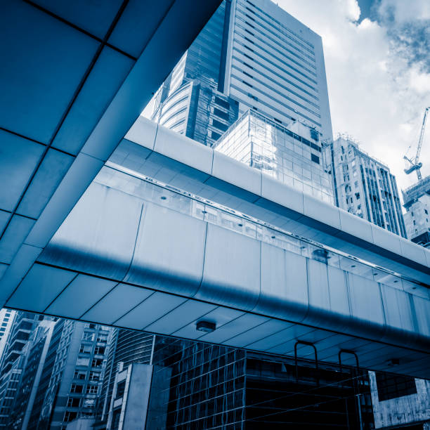 istock modern skyscrapers with skywalk in central district of Hong Kong 643553320