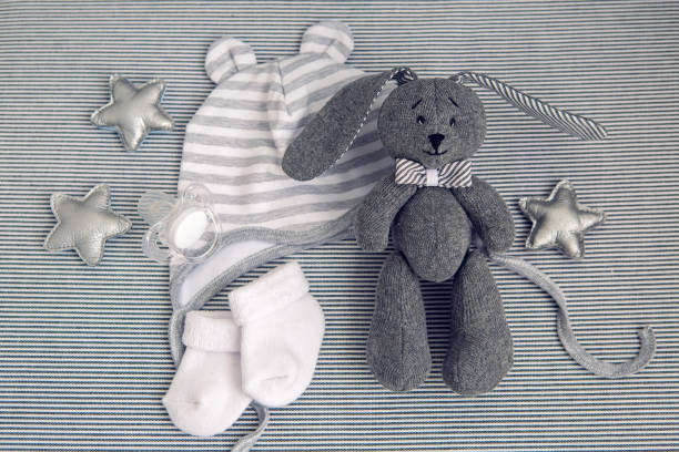 istock round white baby bed with gray pillows 643554236