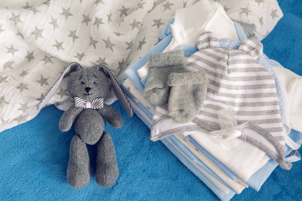 istock baby clothes with diapers are stacked 643554406