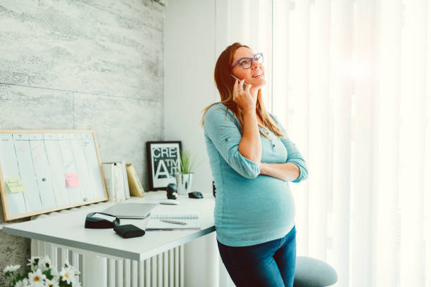 istock Pregnant Businesswoman Working In Her Home Office 643557718