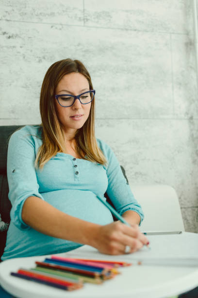istock Pregnant Businesswoman Working In Her Home Office 643559908