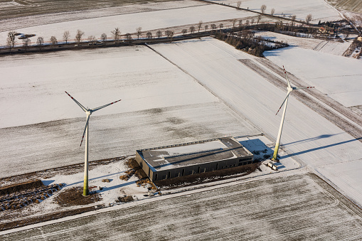 aerial view of wind turbine on a winter field in Poland