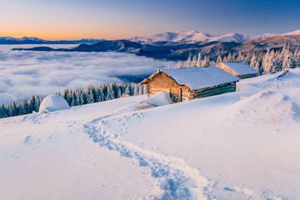 istock chalets in the mountains at sunset 643567158