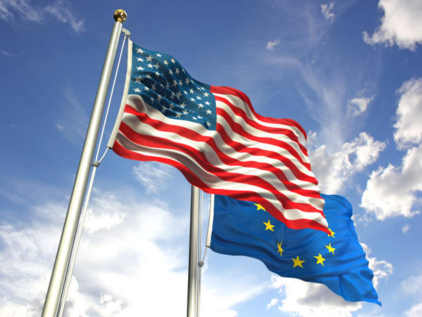 istock American and European Union flags waving against the sky 643567394
