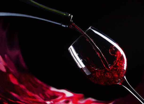 istock bottle and glass of red wine 643570326