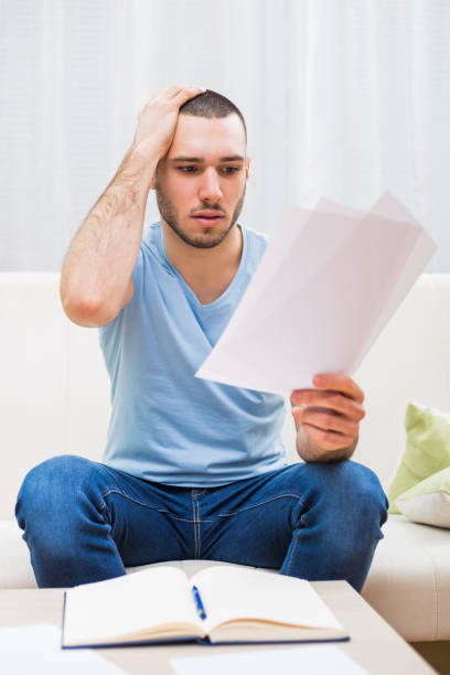 istock Businessman in panic working at home 643574700