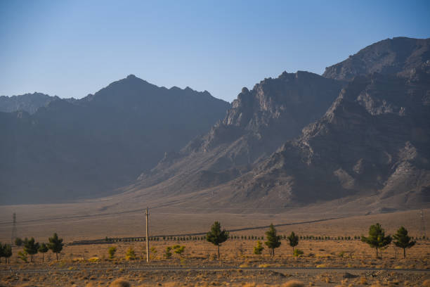 istock road near stone desert and mountain landscape 643575152