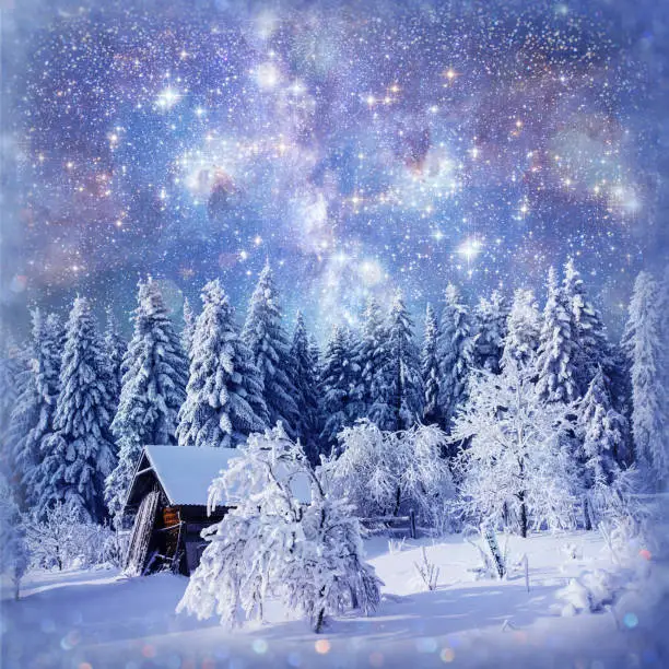fantastic winter landscape. Chalet under the stars. background with some soft highlights and snow flakes