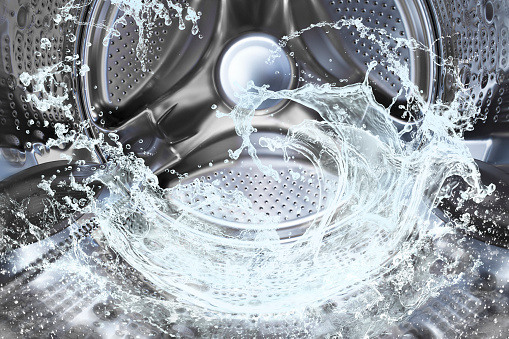 Chapoteo de agua del tambor lavadora photo