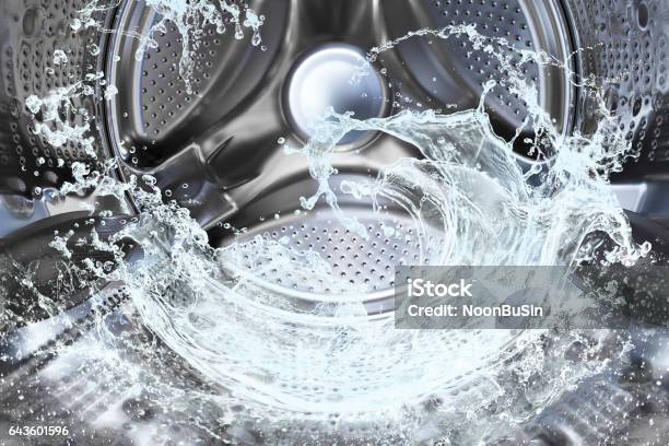 Water Splash Of The Washing Machine Drum Stock Photo - Download Image Now - Laundromat, Laundry, Machinery