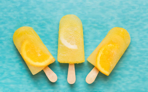 Fruit ice cream lollies with fresh fruits
