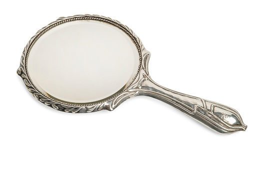 Antique ornate silver hand mirror cut out
