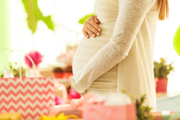 istock Woman holding pregnant belly 643625254