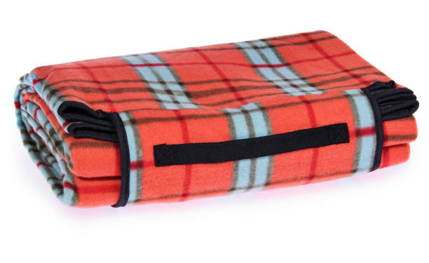istock Folded up travel, picnic blanket grille with red, blue, black. 643632946