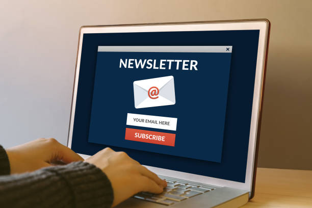 Subscribe newsletter concept on laptop computer screen on wooden table