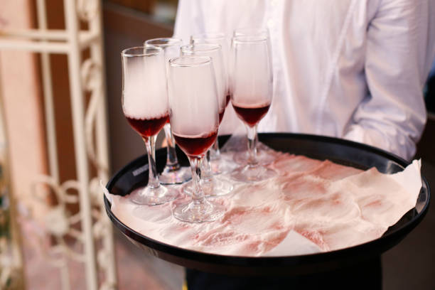 istock Waiter with glasses of champagne 643641064