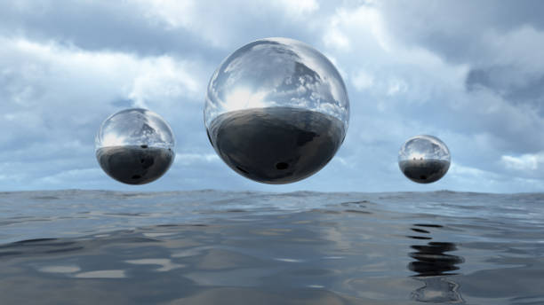 3D rendering abstract liquid transparent sphere above water 3D illustration of transparent liquid balls hoovering above water. A close-up of abstract organic elements. Silver shiny colored textures with a lot of reflection. metal sphere stock pictures, royalty-free photos & images