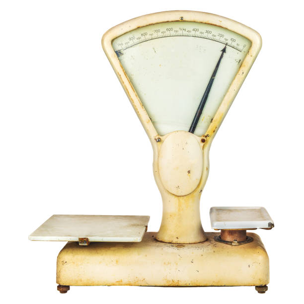 Vintage weathered weighing scale isolated on a white background