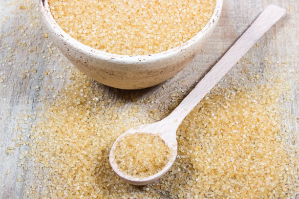 istock Brown sugar cane on the wooden background. 643660082