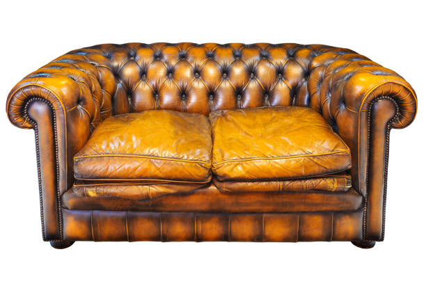 istock Vintage brown leather Chesterfield sofa isolated on white 643666448