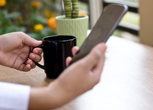 istock Businesswoman using smart phone at office 643670406