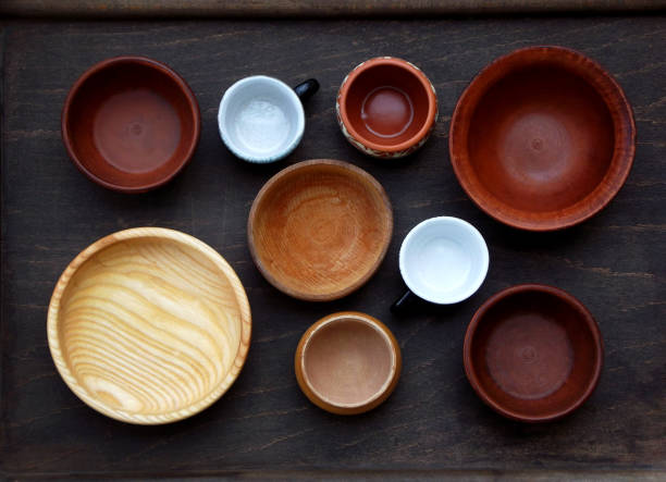 istock Ceramic, wooden, clay empty handmade bowl and cup on dark background. Pottery earthenware utensil, kitchenware. 643672774