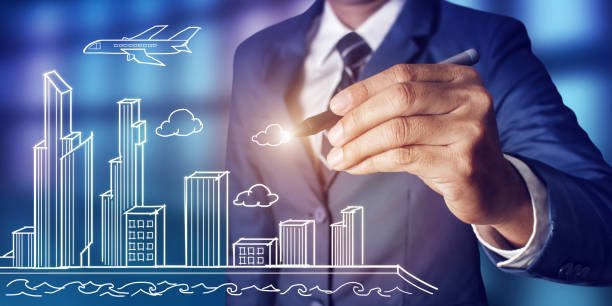 istock Businessman drawing city scheme concept 643672826
