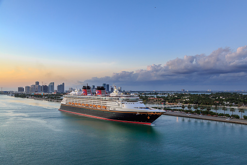 At Port of Miami, Miami, Florida- November 27, 2016: Disney MAGIC Cruise ship sailing from port of miami during sunset.