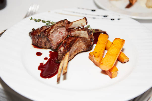 istock Close up Tasty Grilled Pork Rib and Fried Potatoes 643673436