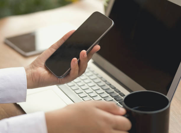 istock Businesswoman using smart phone 643680360