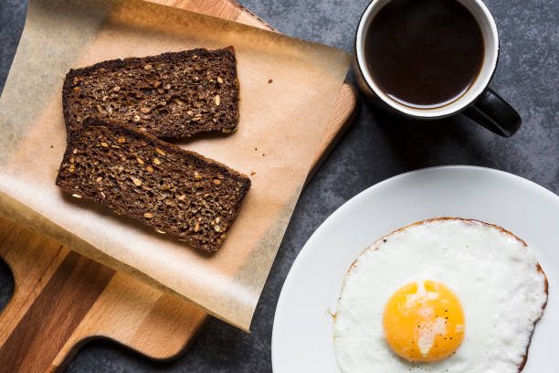 Breakfast with rye bread and fried egg stock photo
