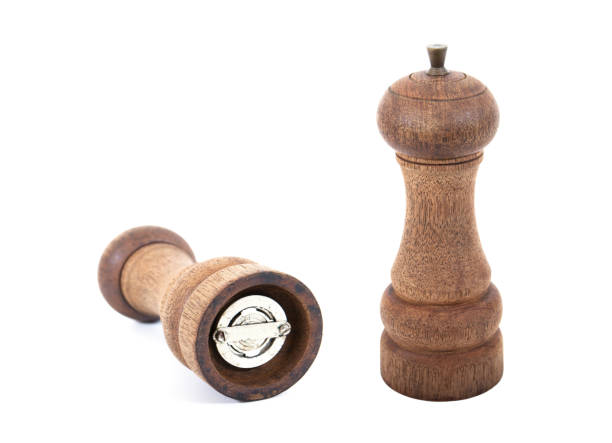 istock Pepper grinder isolated on white.Two old wooden pepper grinder isolated 643687794