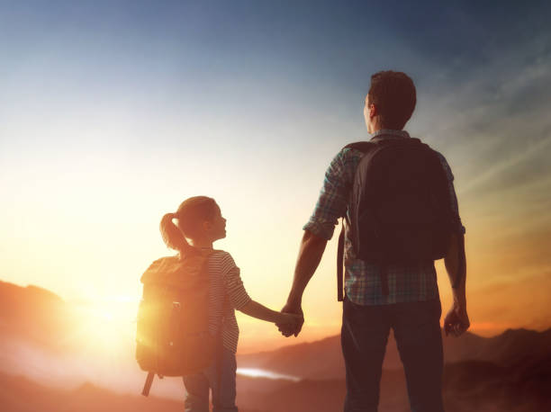 istock Kid and dad look at sunset 643693492