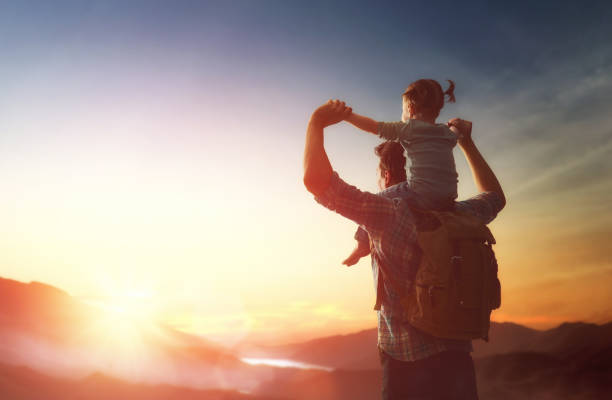 istock Kid and dad look at sunset 643693496