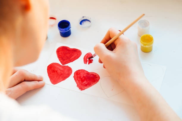 istock woman's hand paint colors heart 643704234