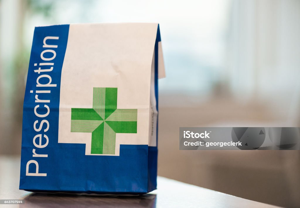 Prescription medicine in a paper bag A close-up image of a paper bag containing prescribed medical items. Prescription Medicine Stock Photo