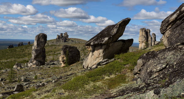 istock Detached granite rocks of unusual shape on the dais. 643714430