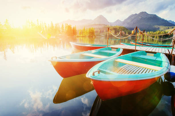 istock Boat on the dock surrounded mountains. Fantastic Shtrbske Pleso 643724802