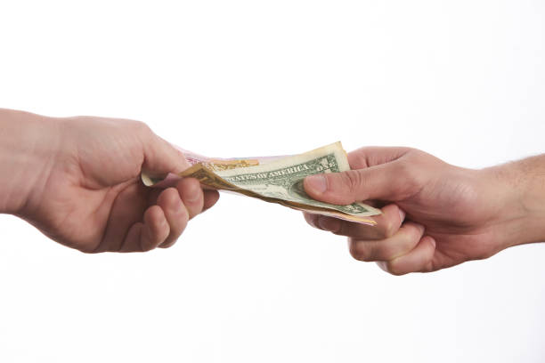 istock Giving a bribe. Money in hand.Concept - corruption 643727334