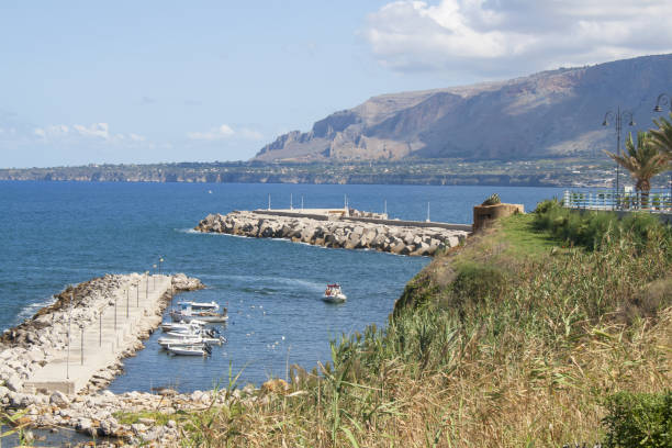 Coastline view from Via Marina in Trappeto Italy of a boat marina next to the beach