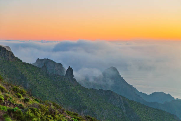 istock sunset over the mountains in the clouds 643731466