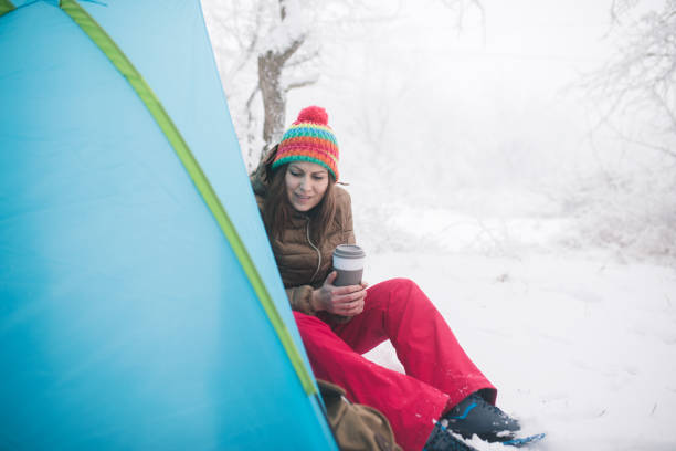 istock Woman inside tent set in winter hiking 643733938