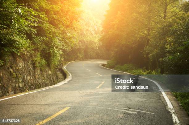Highway At Sunrise Stock Photo - Download Image Now - Winding Road, Country Road, Road