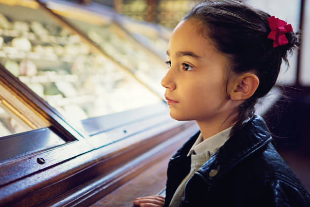 istock Little girl is looking exhibition 643747530