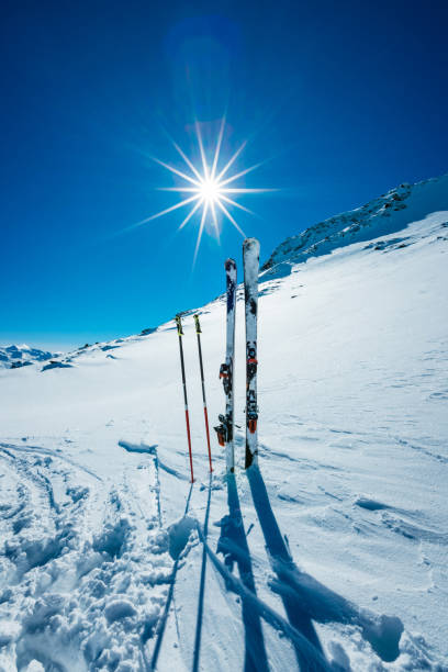 istock Skis and ski poles on remote slope 643750598